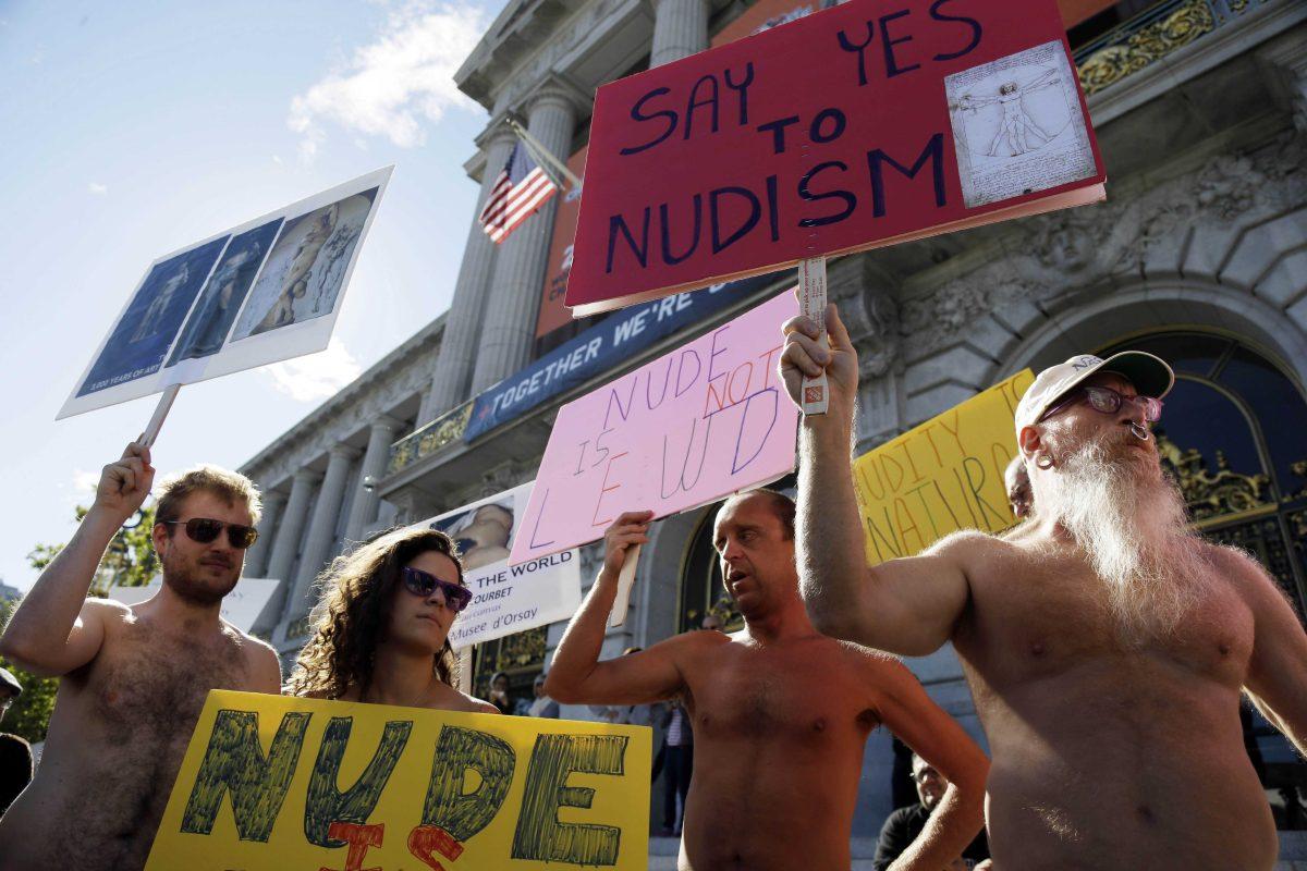 FILE - In this Nov. 14, 2012 file photo, demonstrators gather at a protest against a proposed nudity ban outside of City Hall in San Francisco. A federal judge has cleared the way for San Francisco's ban on most displays of public nudity to take effect on Feb. 1. U.S. District Court Judge Edward Chen ruled Tuesday Feb. 29, 2013 that the city ordinance prohibiting adults from displaying their genitals does not violate the free speech rights of people who like going out in the buff. (AP Photo/Marcio Jose Sanchez, File)