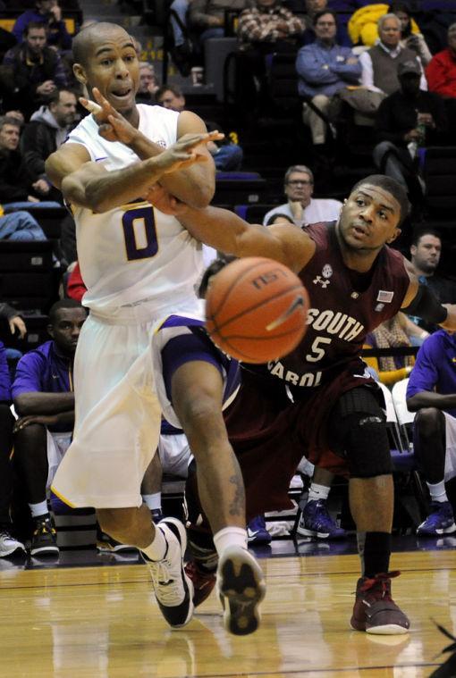 LSU senior guard Charles Carmouche (0) passes Wednesday, Jan. 16, 2013 during the 73-82 overtime loss to the University of South Carolina in the PMAC.
 