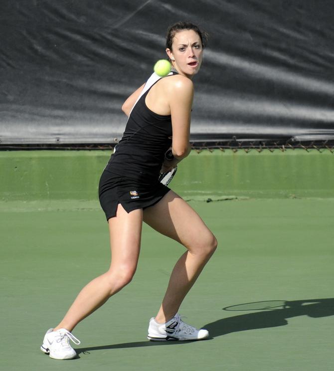 LSU Kaitlin Burns returns Saturday, Jan. 26, 2013 the Northwestern serve during the Tigers' doubles match against the Wildcats at "Dub" Robinson Stadium.
 