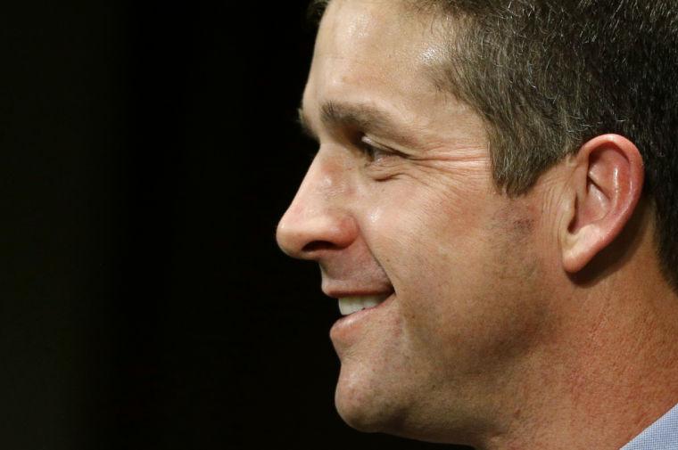 Baltimore Ravens head coach John Harbaugh smiles during an NFL football news conference at the team's practice facility in Owings Mills, Md., Monday, Jan. 21, 2013. The Ravens are scheduled to face the San Francisco 49ers in Super Bowl XLVII in New Orleans on Sunday, Feb. 3. (AP Photo/Patrick Semansky)
 