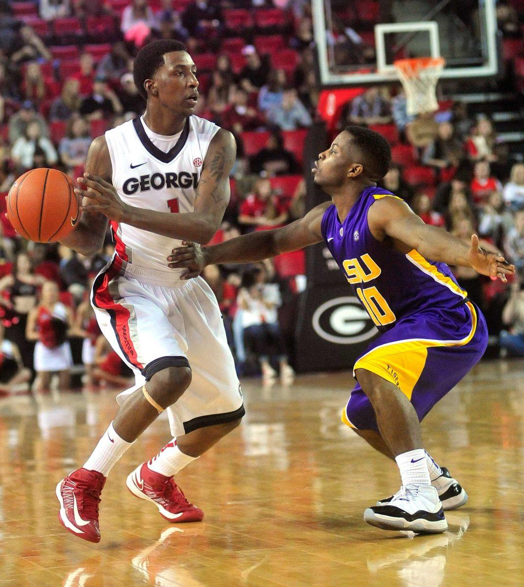 LSU guard Andre Stringer (10) closely guards Georgia guard Kentavious Caldwell-Pope (1) during the first half of an NCAA college basketball game Saturday, Jan. 19, 2013, in Athens, Ga. (AP Photo/Athens Banner-Herald, Richard Hamm) MANDATORY CREDIT MAGS OUT