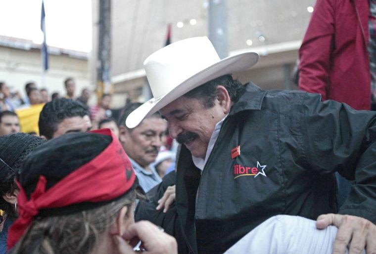 Honduras former President Manuel Zelaya arrives to attend an opposition demonstration against recent laws approved by congress outside parliament in Tegucigalpa, Honduras, Thursday Jan. 24, 2013. Honduras has been on the brink of bankruptcy for months, as lawmakers put off passing a government budget necessary to pay for basic government services. The country is also grappling with $5 billion in foreign debt, the biggest hole in its history and equivalent to last year&#8217;s entire government budget.(AP Photo/Alberto Arce)
 