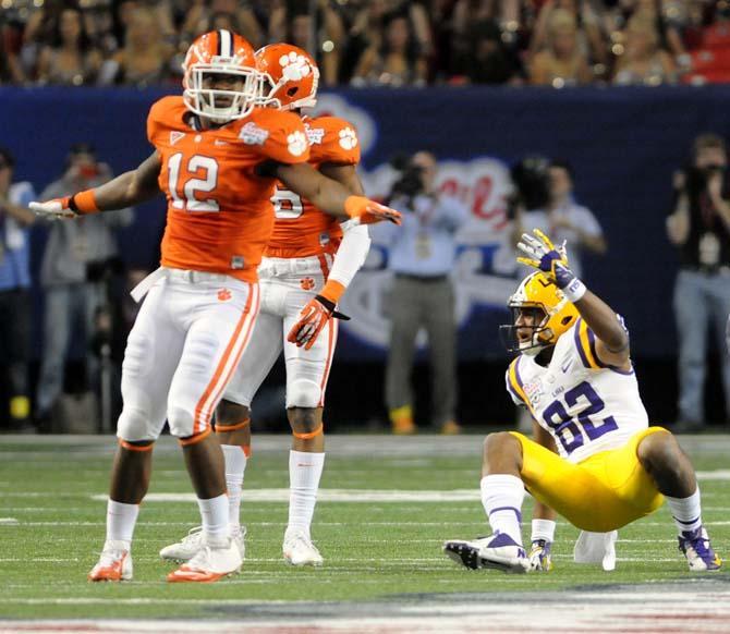 LSU junior wide receiver James Wright (82) wants a flag while Clemson sophomore linebacker Stephone Anthony (12) signals for an incomplete pass Dec. 31, 2012 during LSU's 24-25 Chick-fil-A Bowl loss.
 