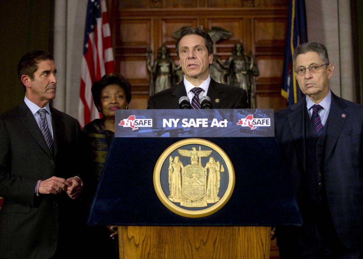 New York Gov. Andrew Cuomo speaks after signing New York's Secure Ammunition and Firearms Enforcement Act into law during a ceremony in the Red Room at the Capitol on Tuesday, Jan. 15, 2013, in Albany, N.Y. Also pictured from left are Senate co-leader Jeffrey Klein, D-Bronx, Senate Democratic Leader Andrea Stewart-Cousins, D-Yonkers, and Assembly Speaker Sheldon Silver, D-Manhattan. (AP Photo/Mike Groll)