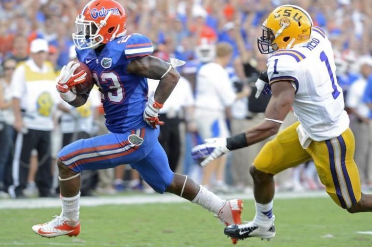 (PHIL SANDLIN/ASSOCIATED PRESS)
Florida running back Mike Gillislee runs past LSU safety Eric Reid into the end zone to seal the Gators 14-6 victory Saturday in Ben Hill Griffin Stadium.