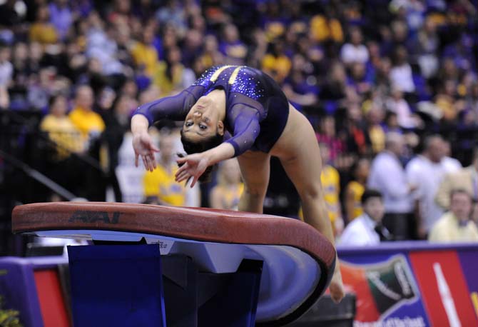 LSU freshman all-around Jessica Savona vaults Friday, Jan. 11, 2013 during the Tiger's 196.875-196.575 win over Florida in the PMAC.
 