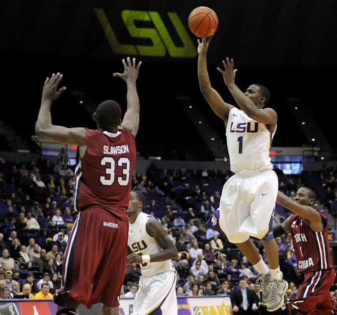 LSU sophomore guard Anthony Hickey (1) shoots Wednesday, Jan. 16, 2013 over University of South Carolina's junior forward RJ Slawson (33) during the Tigers' 73-82 loss to the Gamecocks in the PMAC.
 