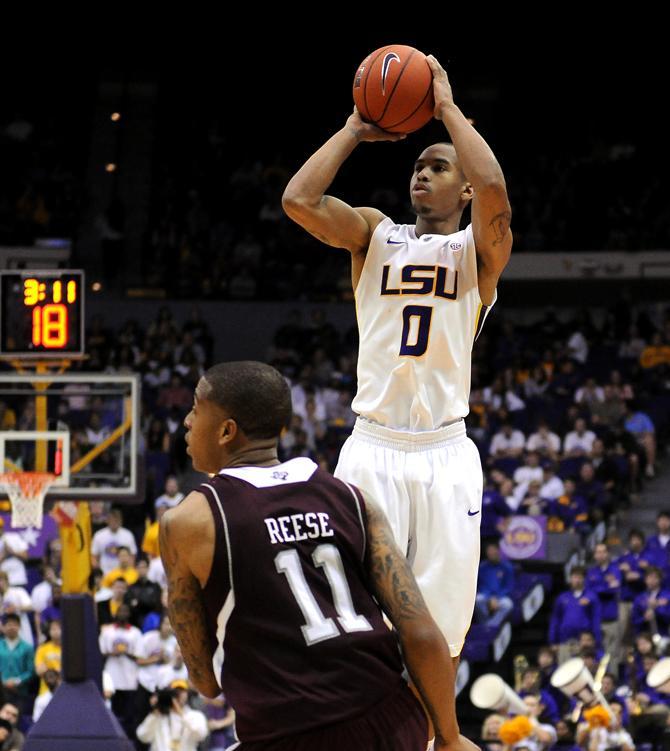 LSU senior guard Charles Carmouche (0) shoots Wednesday, Jan. 23, 2013 over Texas A&amp;M freshman guard J'Mychal Reese (11) in the Tigers' 58-54 victory over the Aggies.
 