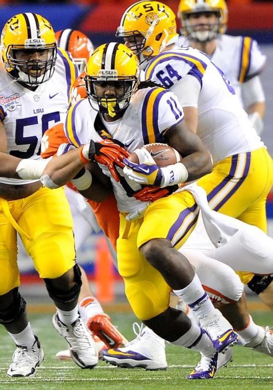 LSU junior running back Spencer Ware (11) carries the ball Monday, Dec. 31, 2012 during the Tigers' 24-25 loss in the Chick-fil-A Bowl against Clemson in Atlanta, Ga.
 