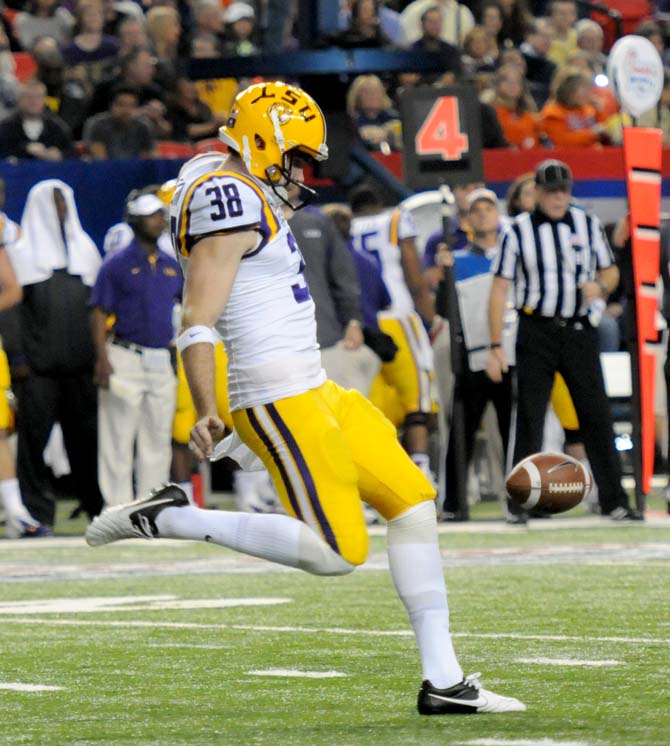 LSU freshman punter Jamie Keehn (38) punts the ball Dec. 31, 2012 during LSU's 24-25 loss to Clemson in the Chick-fil-A Bowl in Atlanta, Ga. Keehn replaced junior Brad Wing after Wing was suspended Dec. 20.
 