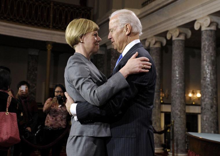 Sen. Tammy Baldwin, D-Wis. is hugged by Vice President Joe Biden during a mock swearing in ceremony on Capitol Hill in Washington, Thursday, Jan. 3, 2013, as the 113th Congress officially began. (AP Photo/Cliff Owen)
 