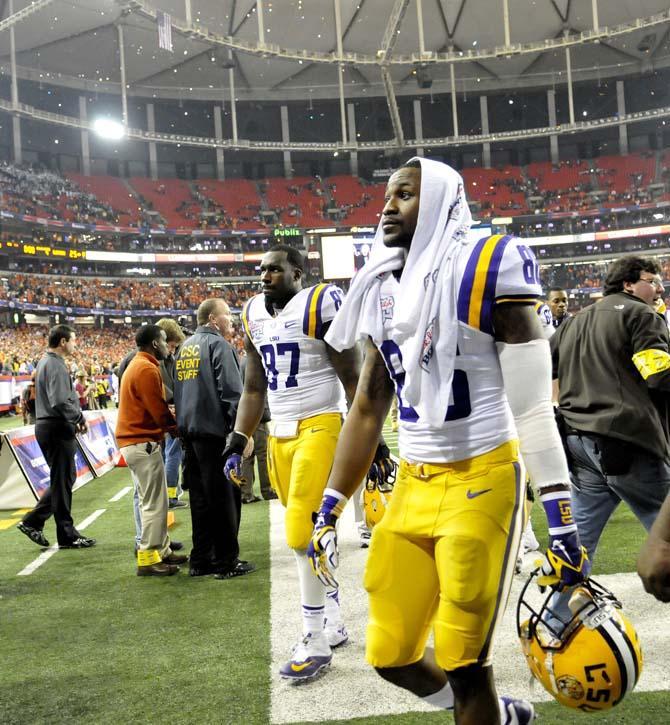 LSU senior defensive end Chancey Aghayere and junior wide receiver Kadron Boone walk off the field Monday, Dec. 31, 2012 after the Tigers' 24-25 loss in the Chick-fil-A Bowl against Clemson in Atlanta, Ga.
 