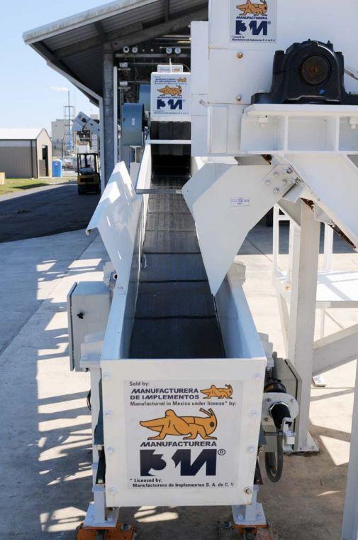 New feedstock processing equipment sits outside Wednesday, Jan. 23, 2013 at the Audubon Sugar Institute in St. Gabriel, La. The machine takes feedstock such as sugarcane and turns it into syrup.
 