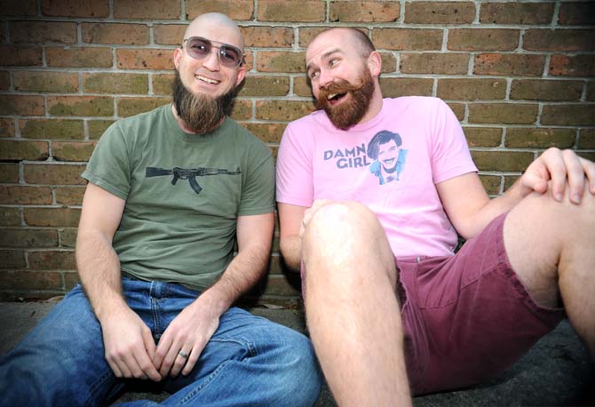 Russ Andre, 29, (left) and psychology junior Boone Wilkinson (right) pose together Sunday Jan. 27, 2013 outside of the design building on campus.
 