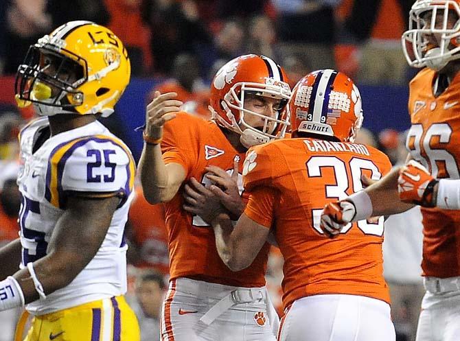 Clemson place kicker Chandler Catanzano (30) celebrates with holder Spencer Benton after kicking the game-winning field goal Monday, Dec. 31, 2012 during the Tigers' 24-25 loss in the Chick-fil-A Bowl against Clemson in Atlanta, Ga.
 