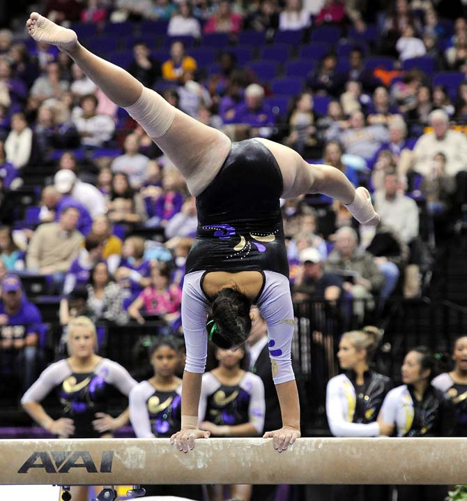 LSU senior all-around Ericka Garcia poses on a balance beam Jan. 4, 2013 during the Tiger's 196-194 win over NC State in the PMAC.
 