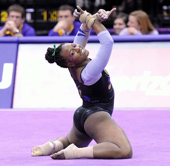 LSU sophomore all-around Llominica Hall finishes her floor routine Jan. 4, 2013 during the Tiger's 196-194 win over NC State in the PMAC. Hall's routine was the second-highest scoring of the night, netting a 9.95 from the judges.
 