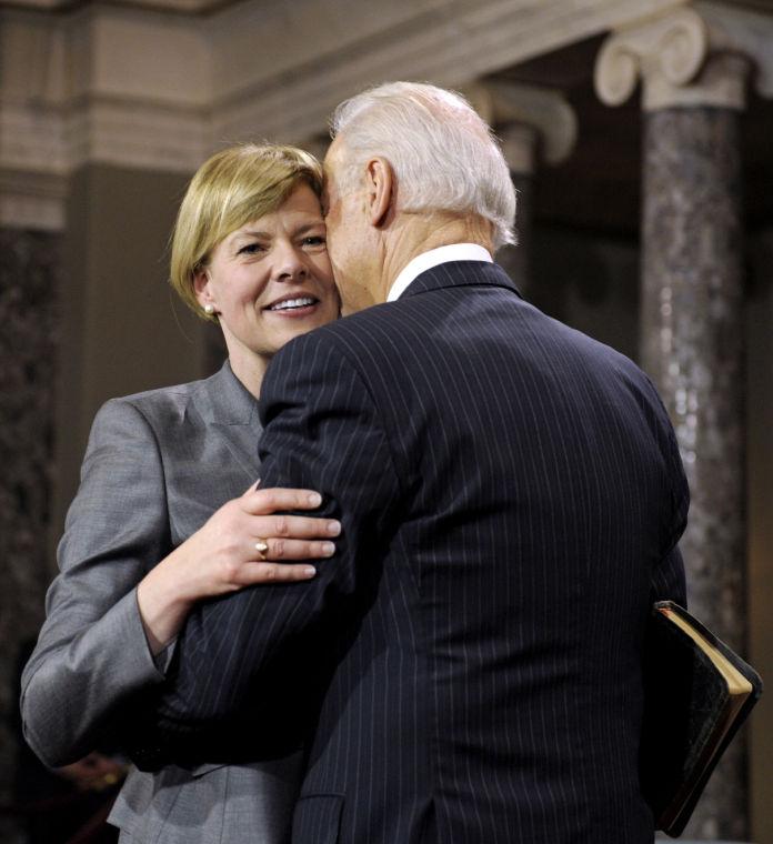 Sen. Tammy Baldwin, D-Wis. is kissed by Vice President Joe Biden during a mock swearing in ceremony on Capitol Hill in Washington, Thursday, Jan. 3, 2013, as the 113th Congress officially began. (AP Photo/Cliff Owen)
 