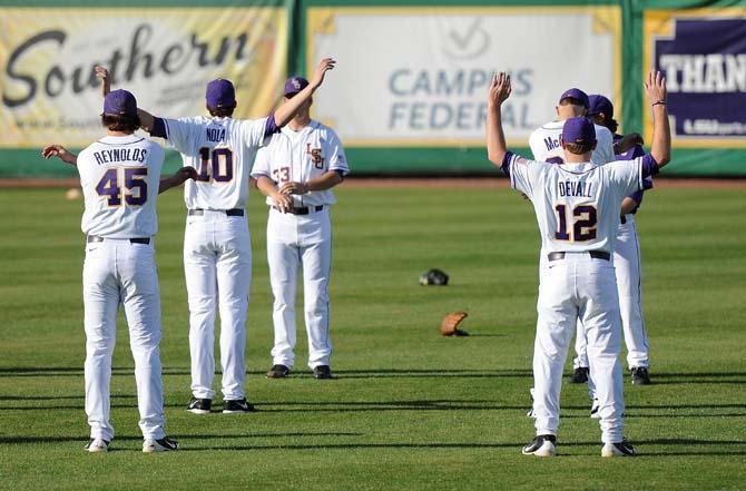 Members of LSU's baseball team warm up Friday, Jan. 25, 2013 for the first practice of preseason in Alex Box Stadium.
 