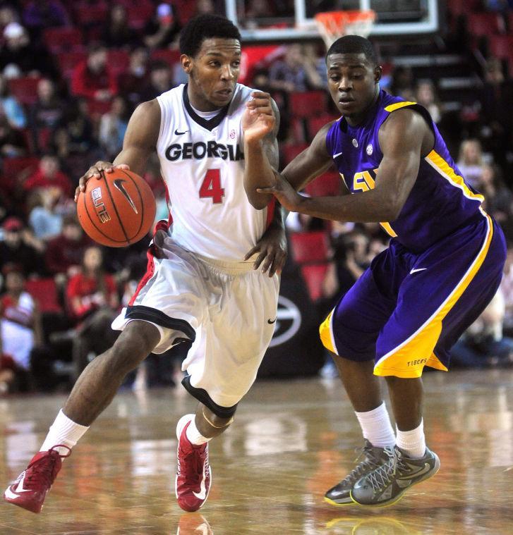 LSU guard Anthony Hickey (1) pressures Georgia guard Charles Mann (4) during the first half of an NCAA college basketball game Saturday, Jan. 19, 2013, in Athens, Ga. (AP Photo/Athens Banner-Herald, Richard Hamm) MANDATORY CREDIT MAGS OUT
 