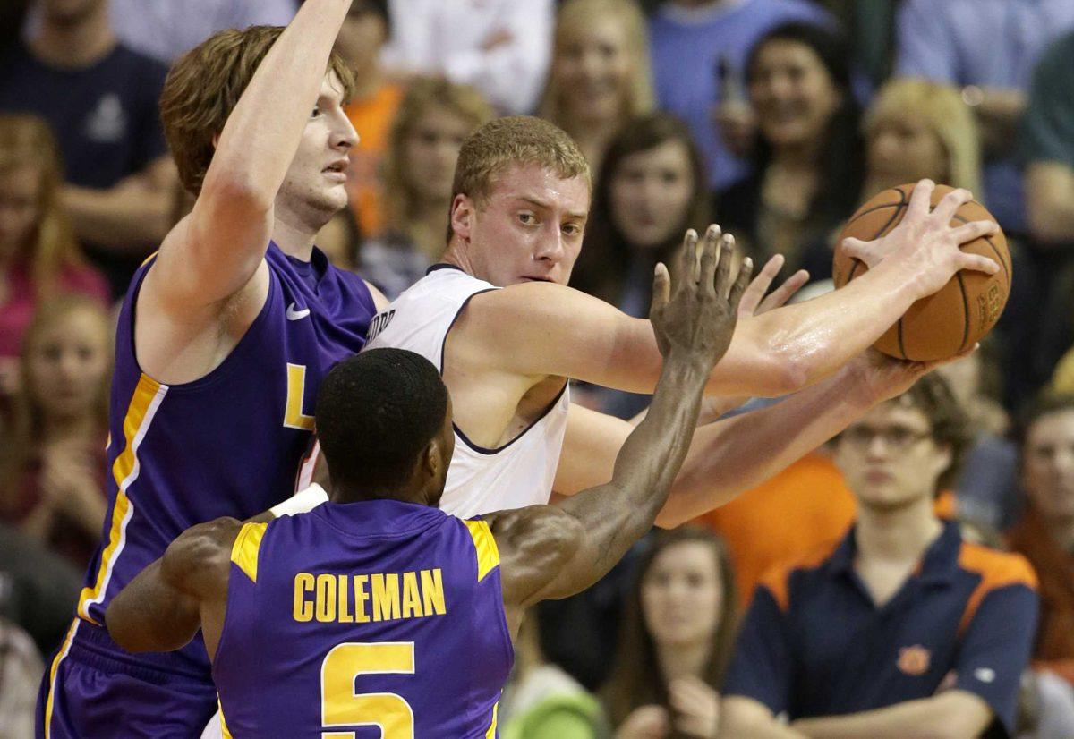 Auburn center Rob Chubb (41) is guarded by LSU forward Shavon Coleman (5) and center Andrew Del Piero (55) in the first half of an NCAA college basketball game at Auburn Arena in Auburn, Ala., Wednesday, Jan. 9, 2013. (AP Photo/Dave Martin)