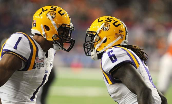 LSU junior safeties Eric Reid (1) and Craig Loston (6) celebrate Dec. 31 after Loston's fumble recovery in the first quarter of the Chick-fil-A Bowl in Atlanta, Ga. LSU would eventually lose to Clemson, 24-25.
 