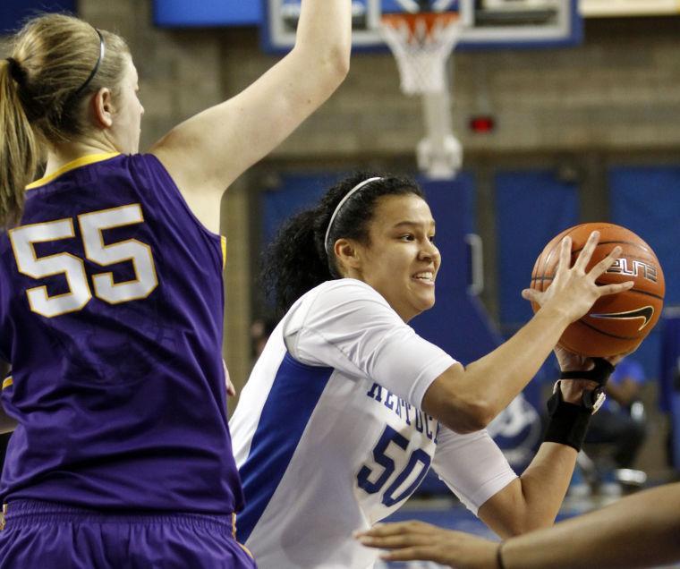 Kentucky's Azia Bishop, right, looks for an open teammate next to LSU's Theresa Plaisance (55) during the second half of an NCAA college basketball game at Memorial Coliseum in Lexington, Ky., Sunday, Jan. 27, 2013. Kentucky defeated LSU 73-60. (AP Photo/James Crisp)
 