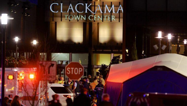 Law enforcement personnel work the scene of a shooting at the Clackamas Town Center in Clackamas, Ore.
 