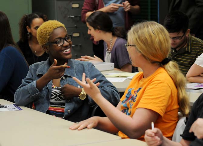 Tayla Richards, anthropology sophomore, introduces herself to a student Monday, Jan. 28, 2013 at a meeting for the Geography and Anthropology Society in the Howe Russell Geoscience Complex.
 