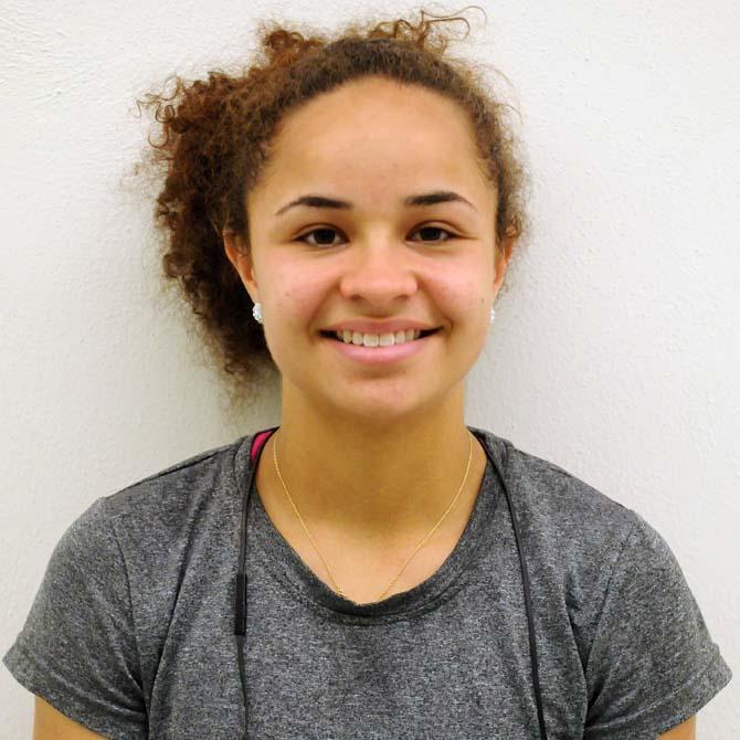 Sports administration sophomore and track team runner Samantha Levin smiles after finishing an hour of straight running on the treadmill as a part of her training on January 13, 2013.
 