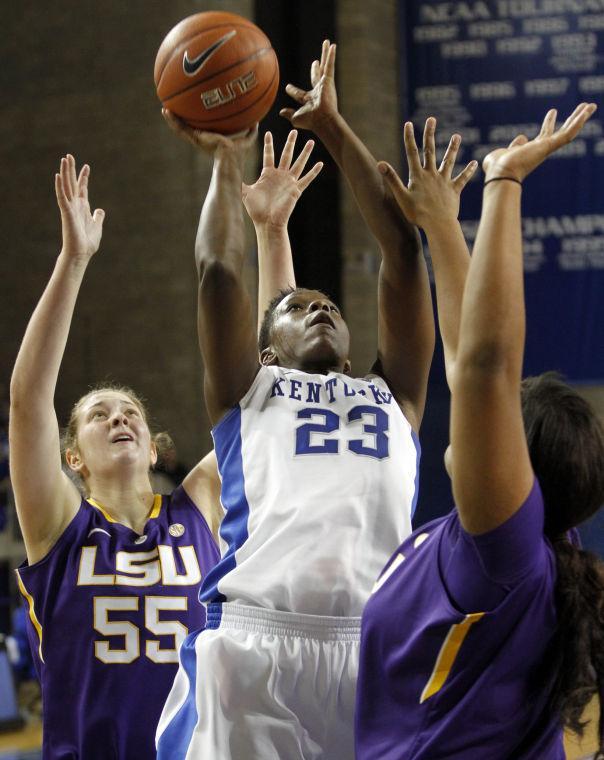 Kentucky's Samarie Walker (23) shoots between LSU's Theresa Plaisance (55) and Derreyal Youngblood during the second half of an NCAA college basketball game at Memorial Coliseum in Lexington, Ky., Sunday, Jan. 27, 2013. Kentucky defeated LSU 73-60. (AP Photo/James Crisp)
 