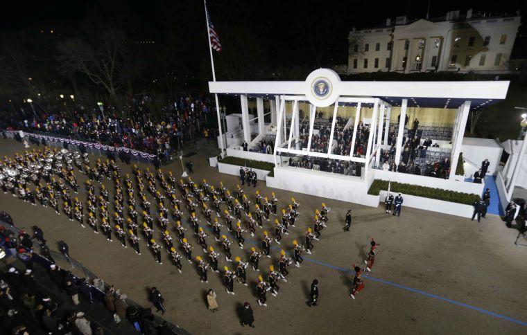 Grambling State University, Tigers, Marching Band, in Louisiana, perform while passing the presidential box and the White House during the Inaugural parade, Monday, Jan. 21, 2013, in Washington. Thousands marched during the 57th Presidential Inauguration parade after the ceremonial swearing-in of President Barack Obama. (AP Photo/Charlie Neibergall)
 