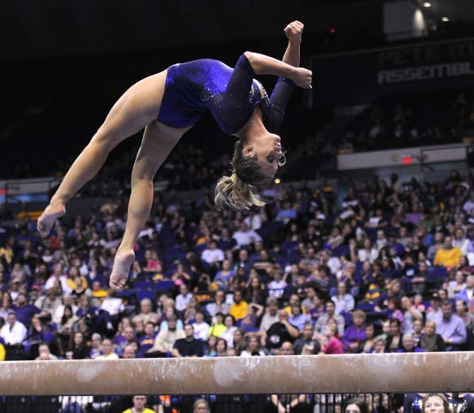 LSU sophomore all-around Jessie Jordan flips on the beam Friday, Jan. 11, 2013 during the Tiger's 196.875-196.575 win over Florida in the PMAC.
 