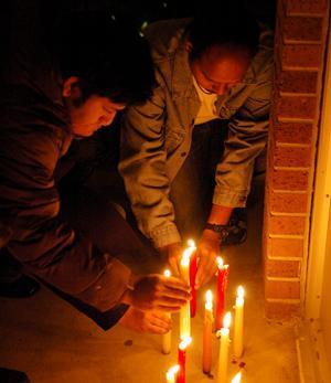 In this 2008 file photo, Students, friends, teachers and collegues of Ph.D. students Chandrasekhar Reddy Komma and Kiran Kumar Allam participate in a candlelight vigil.
 