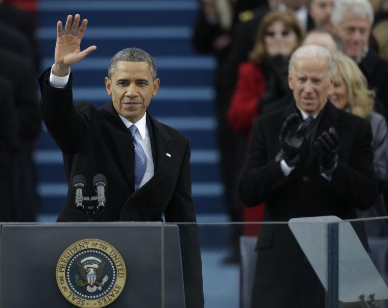 President Barack Obama waves after his speech while Vice President Joe Biden applauds at the ceremonial swearing-in at the U.S. Capitol during the 57th Presidential Inauguration in Washington, Monday, Jan. 21, 2013. (AP Photo/Pablo Martinez Monsivais)
 