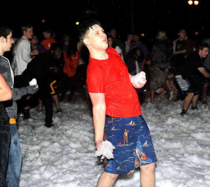 Biology freshman Andrew Bingham, winds up to throw a snowball Monday, Jan. 28, 2013. There were 7 tons of snow on the parade grounds for students to play with.
 