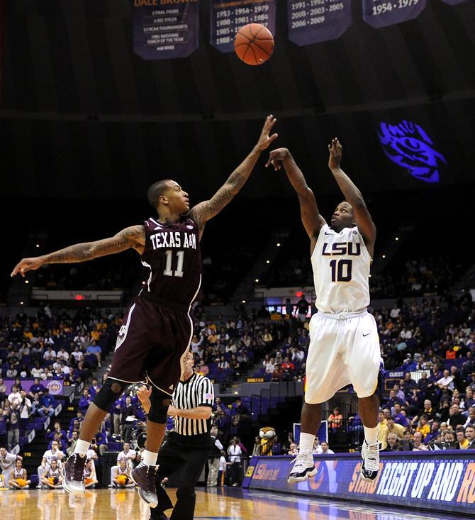 LSU junior guard Andre Stringer (10) launches Wednesday, Jan. 23, 2013 the basketball over Texas A&amp;M freshman guard J'Mychal Reese (11) in the Tigers' 58-54 victory over the Aggies in the PMAC.
 