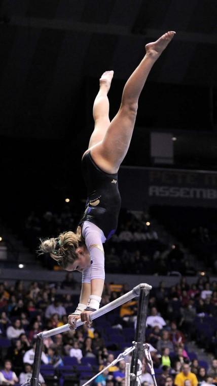 LSU sophomore all-around Jessie Jordan poses on uneven bars Jan. 4, 2013 during the Tiger's 196-194, home-opener win over NC State in the PMAC.
 