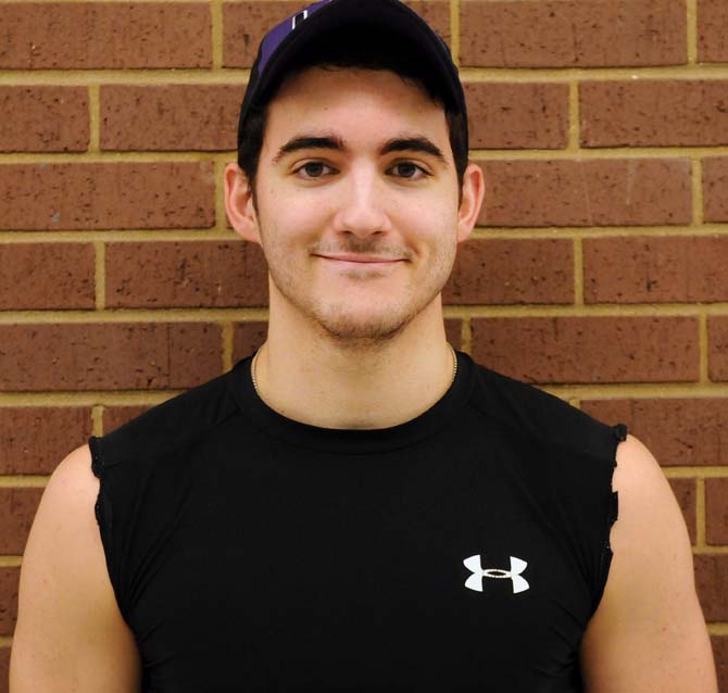 Accounting sophomore Jared Arceneaux smiles post-workout. He has the New Year's resolution to meet the Navy Seal's fitness requirements just to see if he can do it.
 