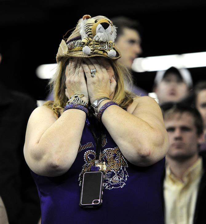 An LSU fan reacts to the heartbreaking loss Monday, Dec. 31, 2012 during the Tigers' 24-25 loss in the Chick-fil-A Bowl against Clemson in Atlanta, Ga.
 