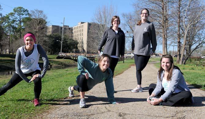 Sole Sisters running participants stand underneath a hand-painted sign Thursday January 17, 2013 in front of the Kappa Delta house near the LSU lakes. (From left to right) Mass communication junior Carley Wahlborg, kinesiology sophomore Caitlyn Babco, accounting junior Molly Longo, mass communication junior Amelia Brown, and elementary education junior Emily Labbe.
 