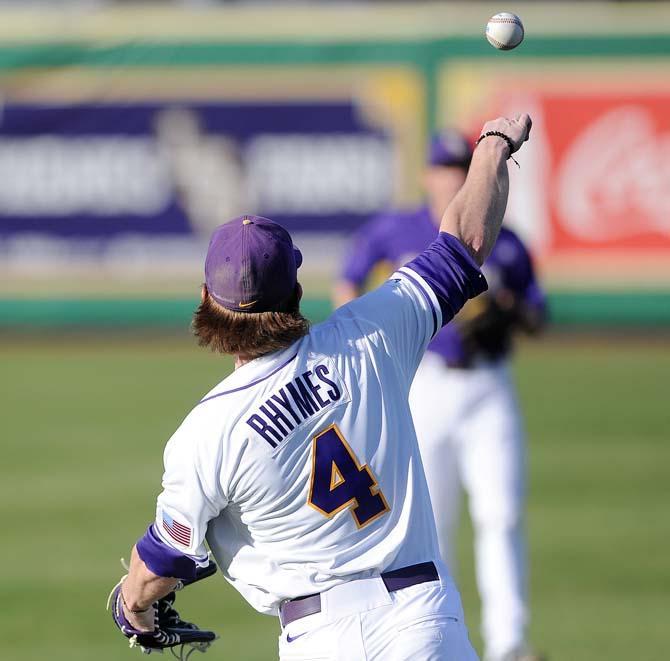 LSU senior outfielder Raph Rhymes (4) throws the ball Jan. 25, 2013 during the Tiger's first preseason practice in Alex Box Stadium.
 