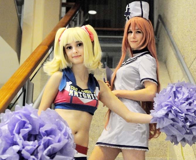 Cosplayers Jenny (left), a sophomore mass communication major, and Rebecca (right), a freshman geology major, are dressed as anime characters in the Student Union on Jan. 13, 2013. Jenny is in costume as Juliet Starling, a character from "Lollipop Chainsaw." Rebecca is dressed up as a nurse as a part of her Luka Megurine costume.
 