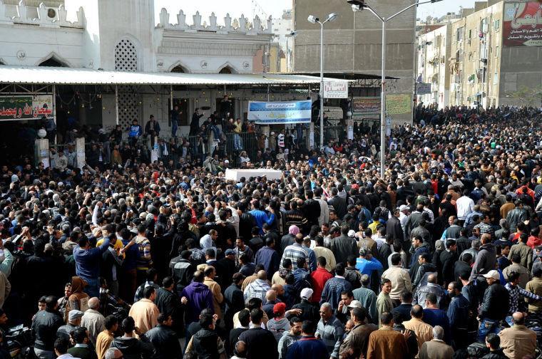 FILE - In this Sunday, Jan. 27, 2013 file photo, Egyptians carry the coffin of a man killed during a mass funeral in Port Said, Egypt. Thousands of mourners chanting for the downfall of Egypt's president marched in funerals again Tuesday in the restive city of Port Said as the army chief warned the state could collapse if the latest political crisis drags on. (AP Photo, File)
 