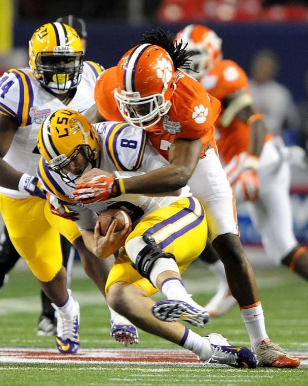 LSU junior quarterback Zach Mettenberger (8) is sacked Monday, Dec. 31, 2012 during the Chick-fil-A Bowl against Clemson in Atlanta, Ga.
 