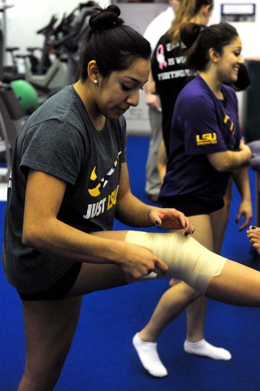 Ericka Garcia, a member of LSU's gymnastics team, wraps her knee Monday, Jan. 28, 2013.
 