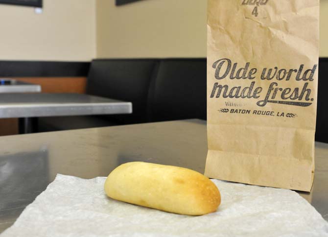 A sausage and cheese kolache rests on a table Saturday January 12, 2013 inside The Kolache Kitchen. The restaurant, owned by Will Edwards, hosted a soft opening Saturday morning.
 