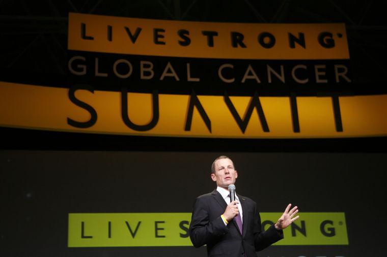 FILE - In this Aug. 24, 2009 file photo, Lance Armstrong speaks at the opening session of the Livestrong Global Cancer Summit in Dublin, Ireland. Armstrong apologized to the staff at his Livestrong cancer foundation before heading to an interview with Oprah Winfrey, a person with direct knowledge of the meeting told The Associated Press. The person spoke on condition of anonymity because the discussion was private. (AP Photo/Peter Morrison, File)
 