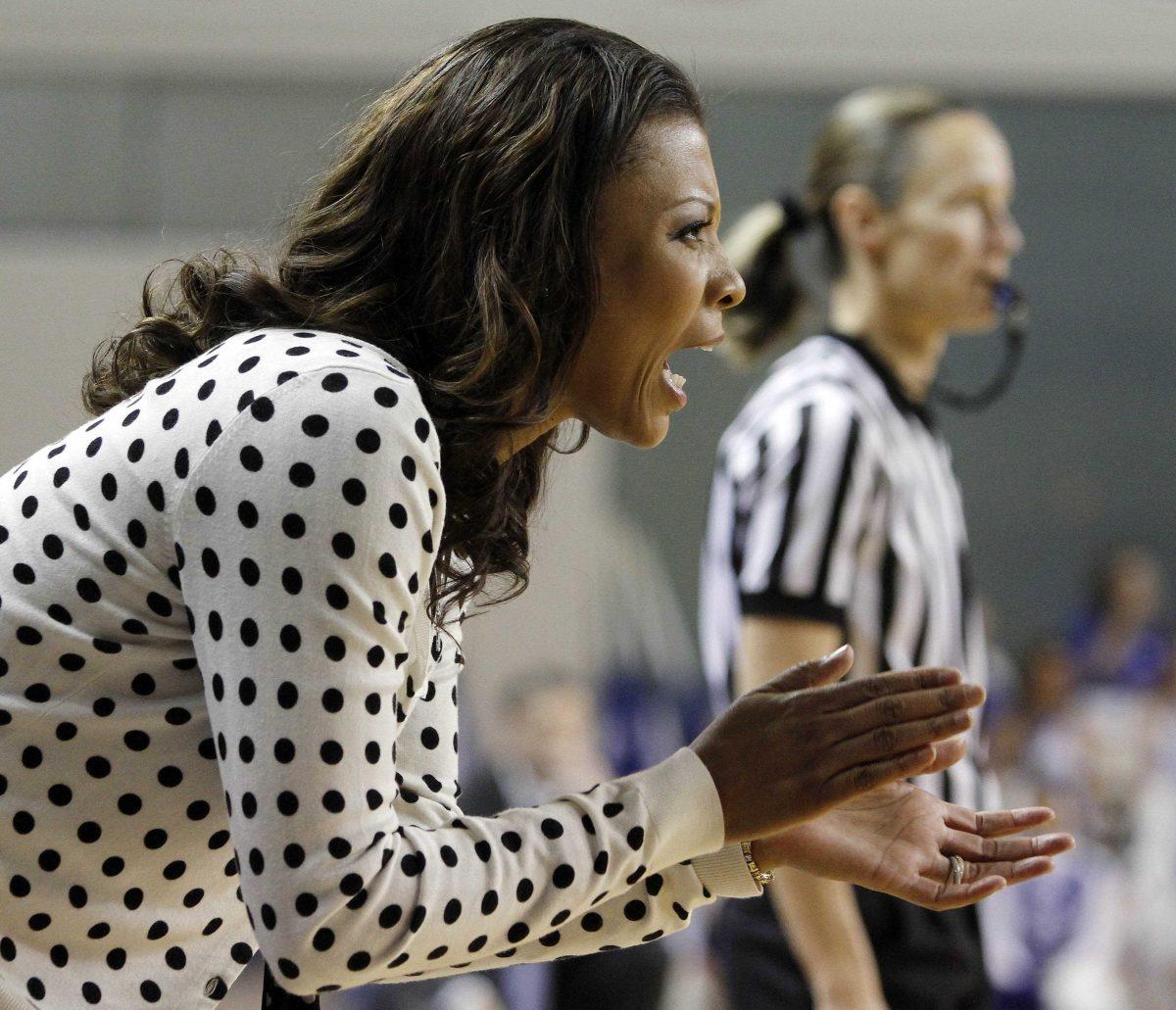 LSU head coach Nikki Caldwell encourages her team during the first half of an NCAA college basketball game against Kentucky at Memorial Coliseum in Lexington, Ky., Sunday, Jan. 27, 2013. (AP Photo/James Crisp)