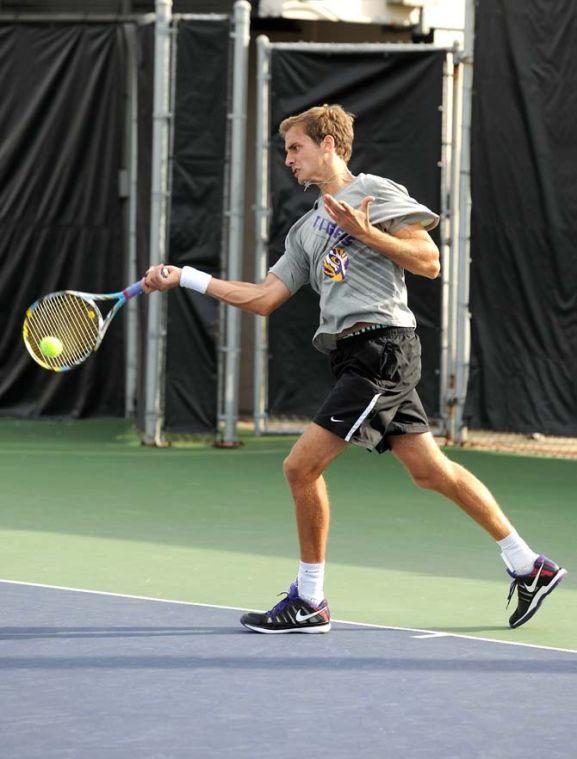 LSU senior Mark Bowtell returns the ball during the Tigers' tennis match against Southern Miss Monday Jan. 21, 2013 in W.T. "Dub" Robinson Stadium.
 